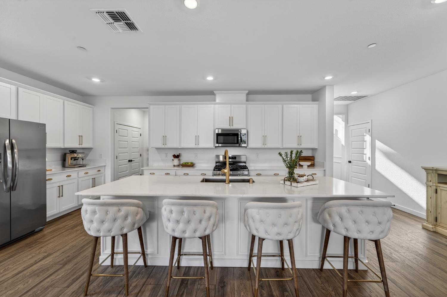 4498 Duckhawk Circle Rancho Cordova, CA 95742 - Photo 18 of 61 a kitchen with refrigerator and chairs