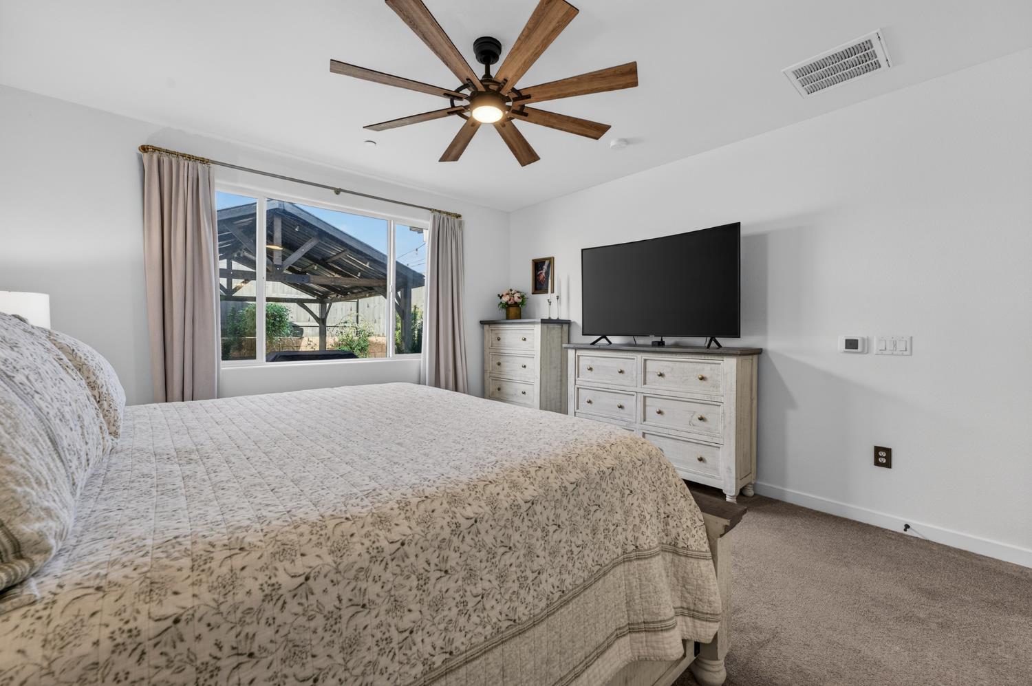 4498 Duckhawk Circle Rancho Cordova, CA 95742 - Photo 21 of 61 a bedroom with a bed and a flat screen tv