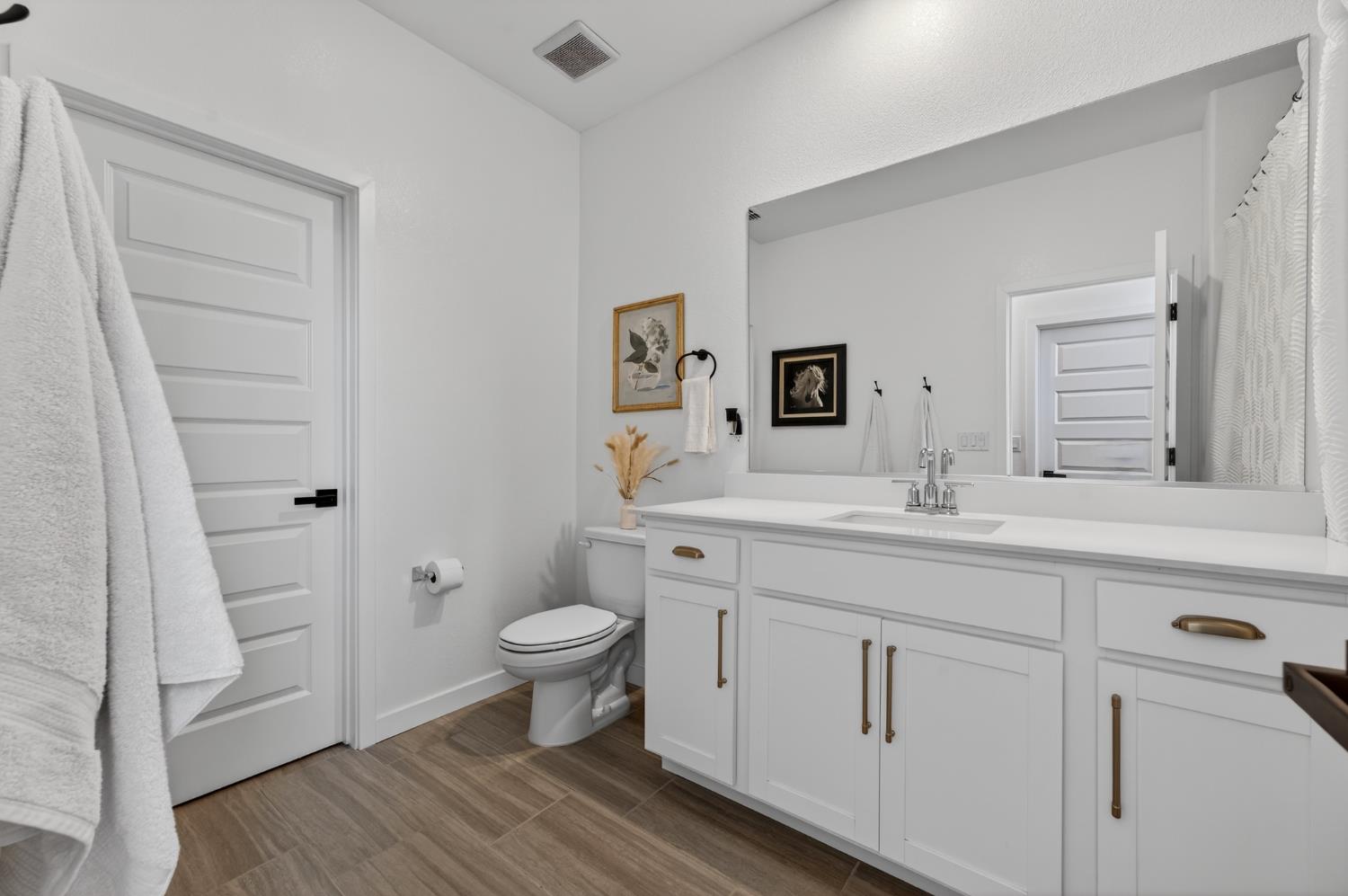 4498 Duckhawk Circle Rancho Cordova, CA 95742 - Photo 42 of 61 a bathroom with a sink a toilet a shower and a mirror