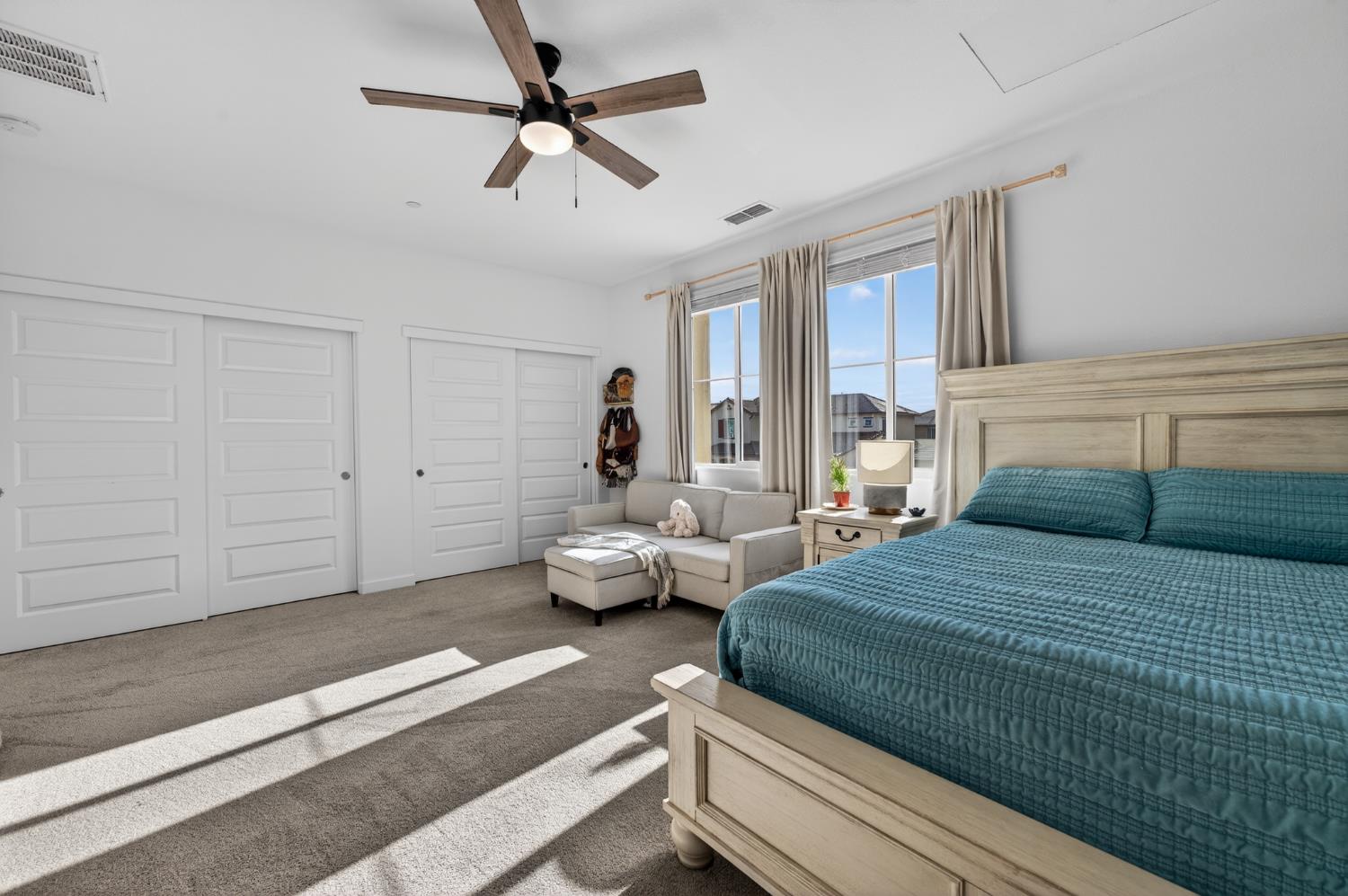 4498 Duckhawk Circle Rancho Cordova, CA 95742 - Photo 46 of 61 a bedroom with a bed and ceiling fan