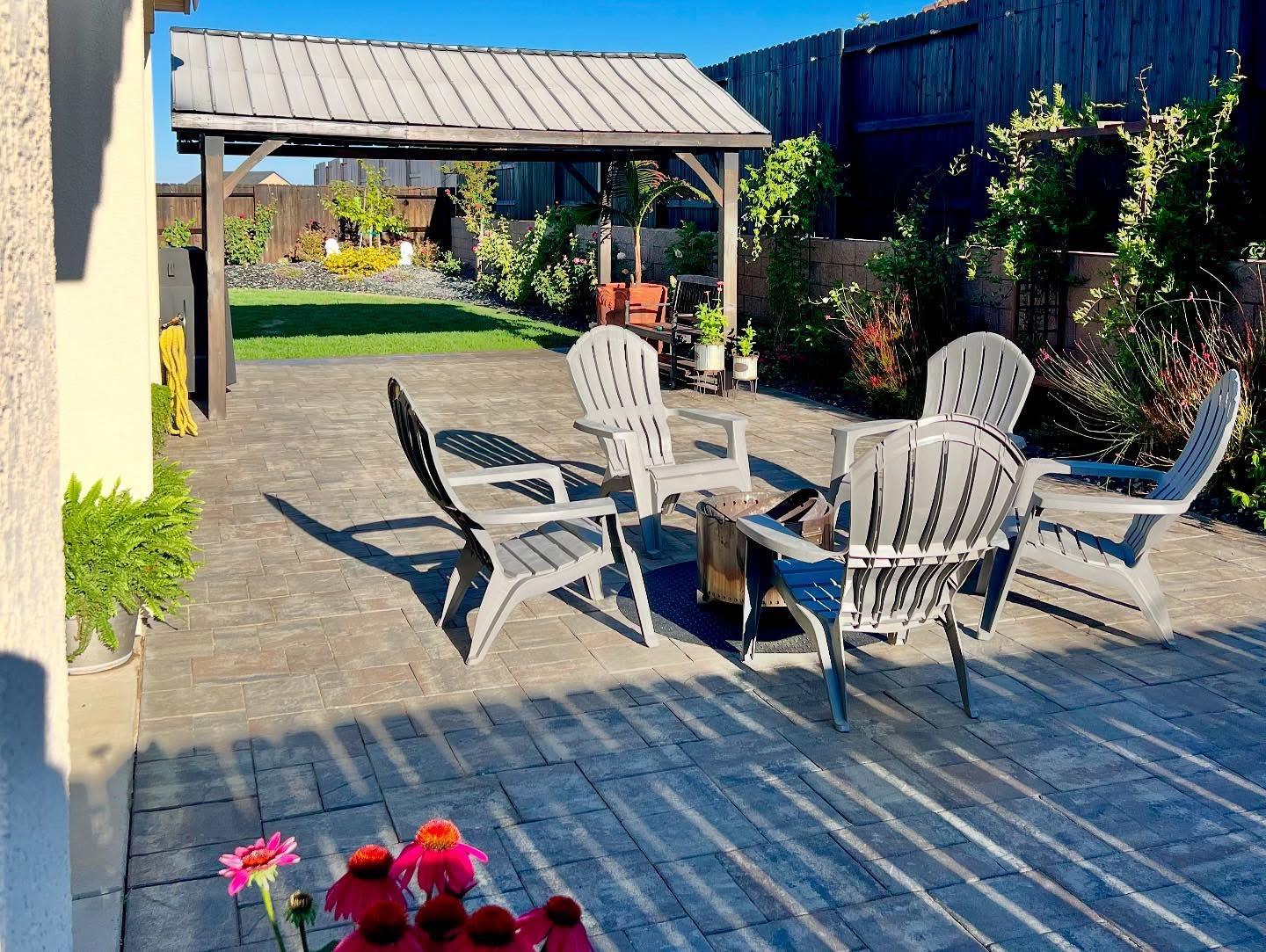 4498 Duckhawk Circle Rancho Cordova, CA 95742 - Photo 49 of 61 a view of a patio with table and chairs potted plants with wooden floor
