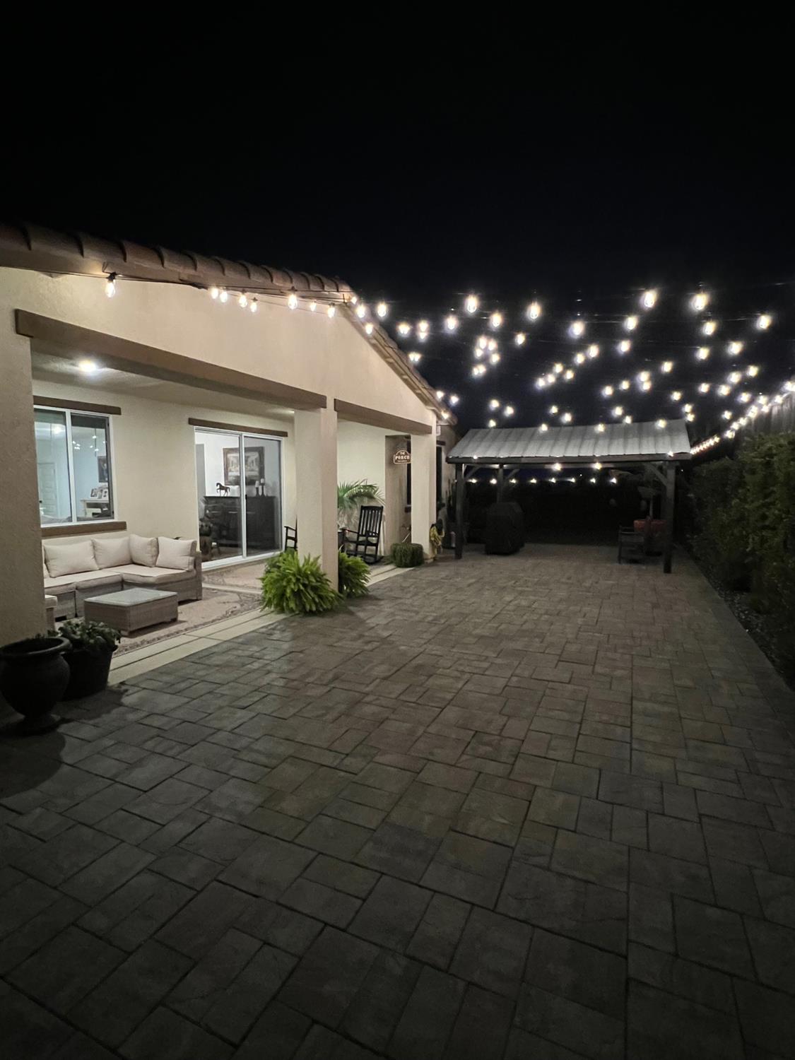 4498 Duckhawk Circle Rancho Cordova, CA 95742 - Photo 53 of 61 a view of a porch with a table and chairs under an umbrella