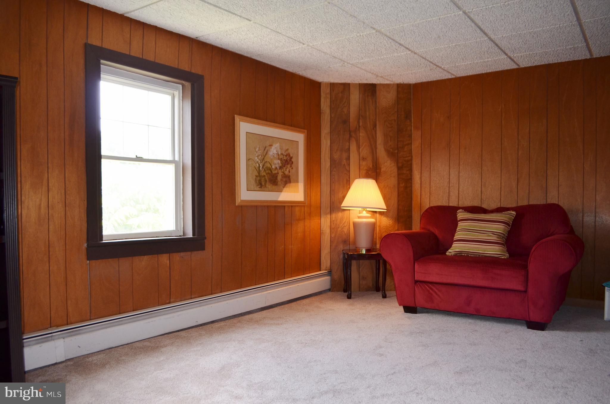 232 North Clear Ridge Road Union Bridge, MD 21791 - Photo 14 of 25 a living room with furniture and a window