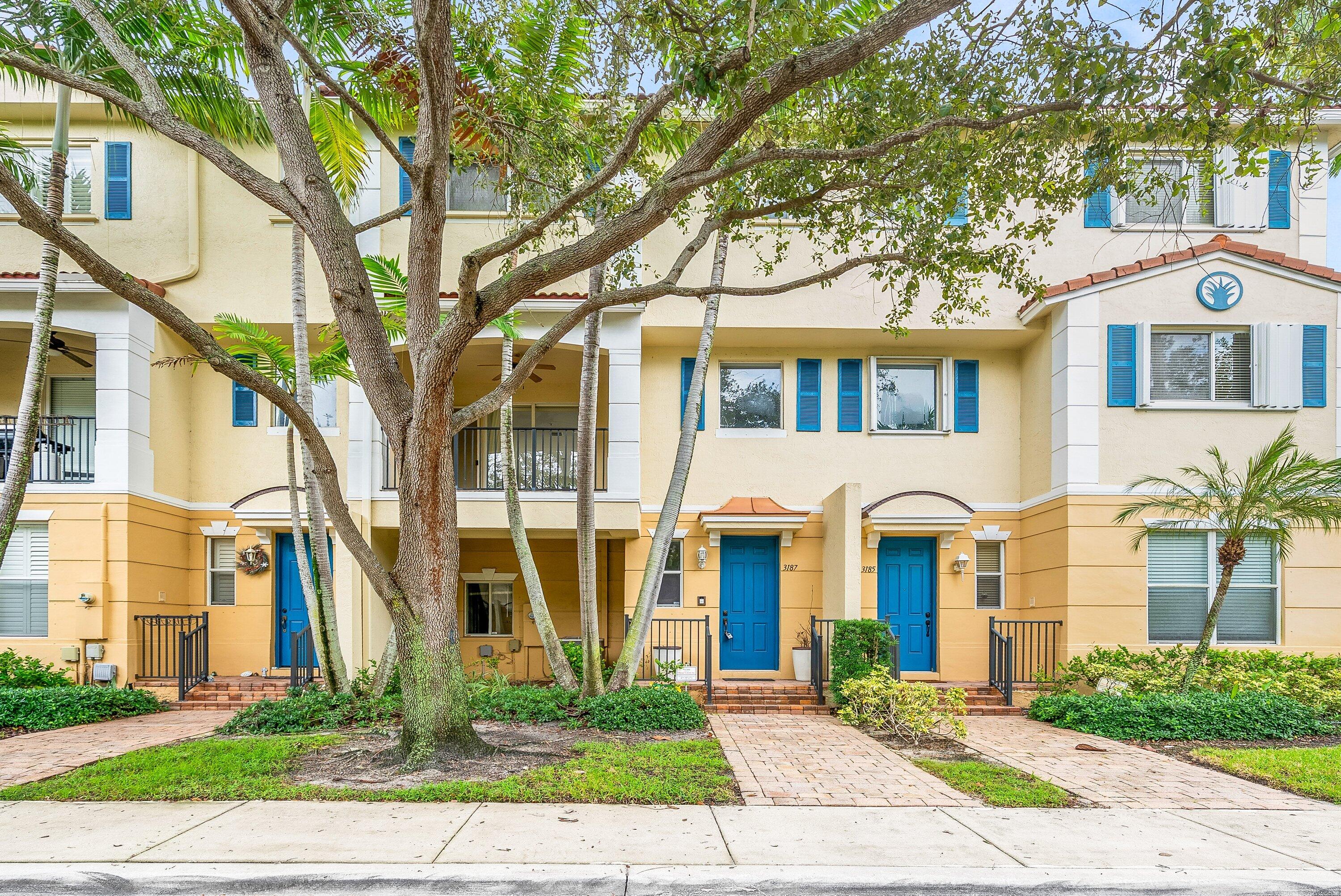 3187 North Oasis Drive Boynton Beach, FL 33426 - Photo 1 of 41 a front view of a residential houses with yard