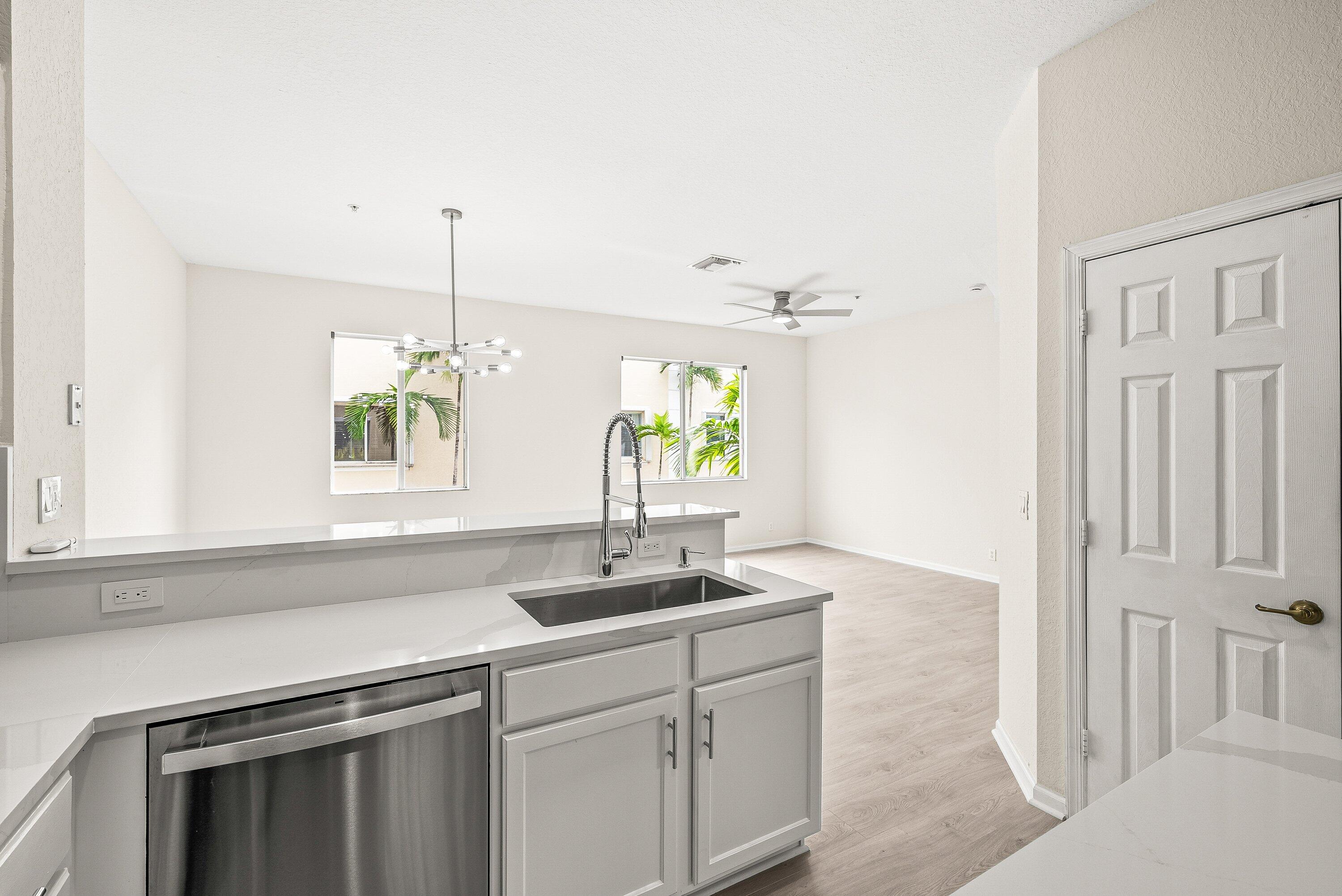 3187 North Oasis Drive Boynton Beach, FL 33426 - Photo 11 of 41 a kitchen with a sink and a window