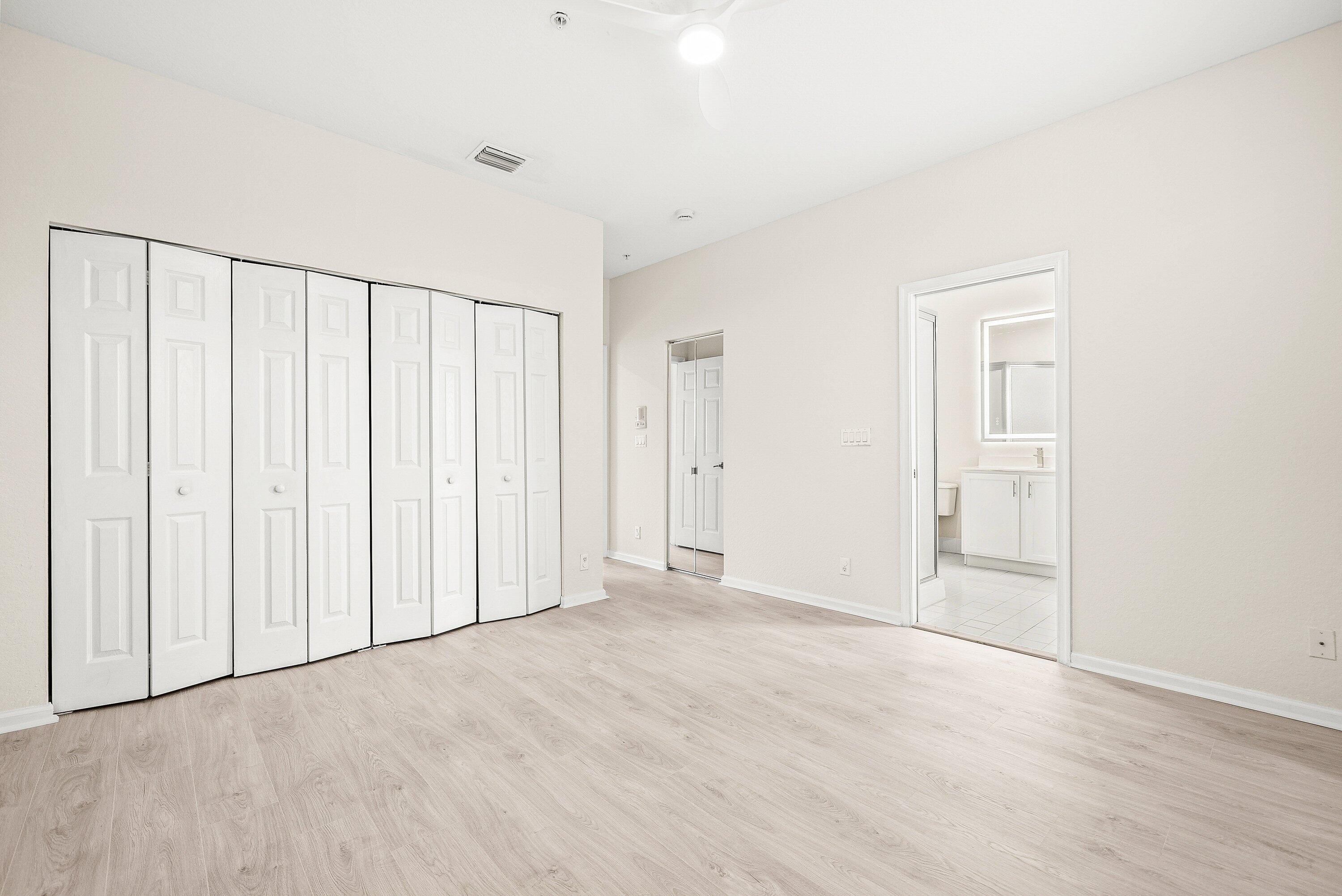 3187 North Oasis Drive Boynton Beach, FL 33426 - Photo 22 of 41 a view of an empty room with wooden floor