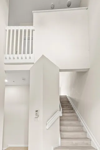 a view of staircase with white walls