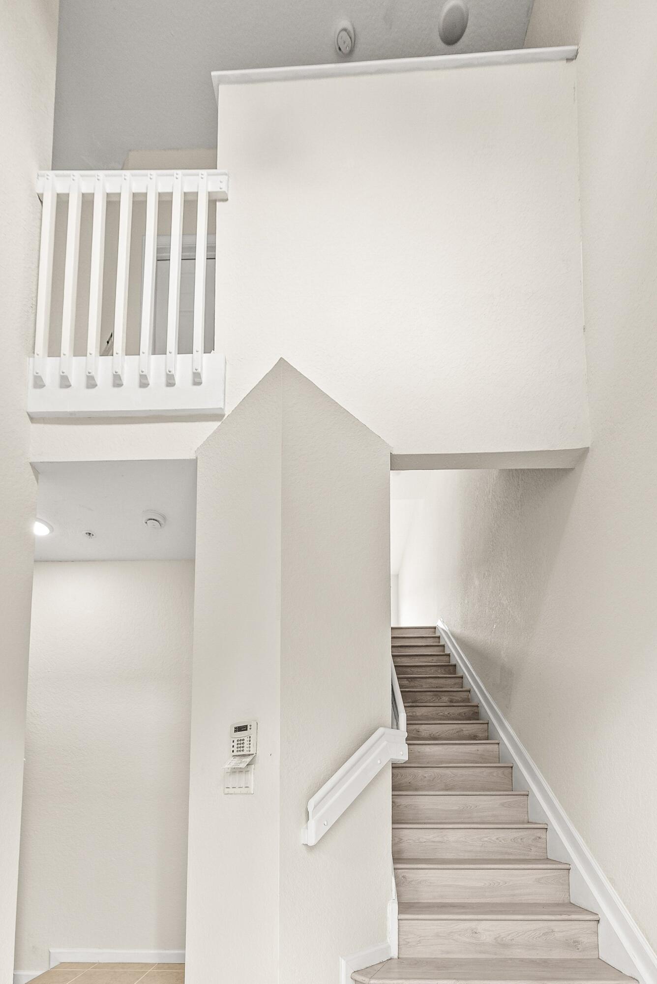 3187 North Oasis Drive Boynton Beach, FL 33426 - Photo 27 of 41 a view of staircase with white walls
