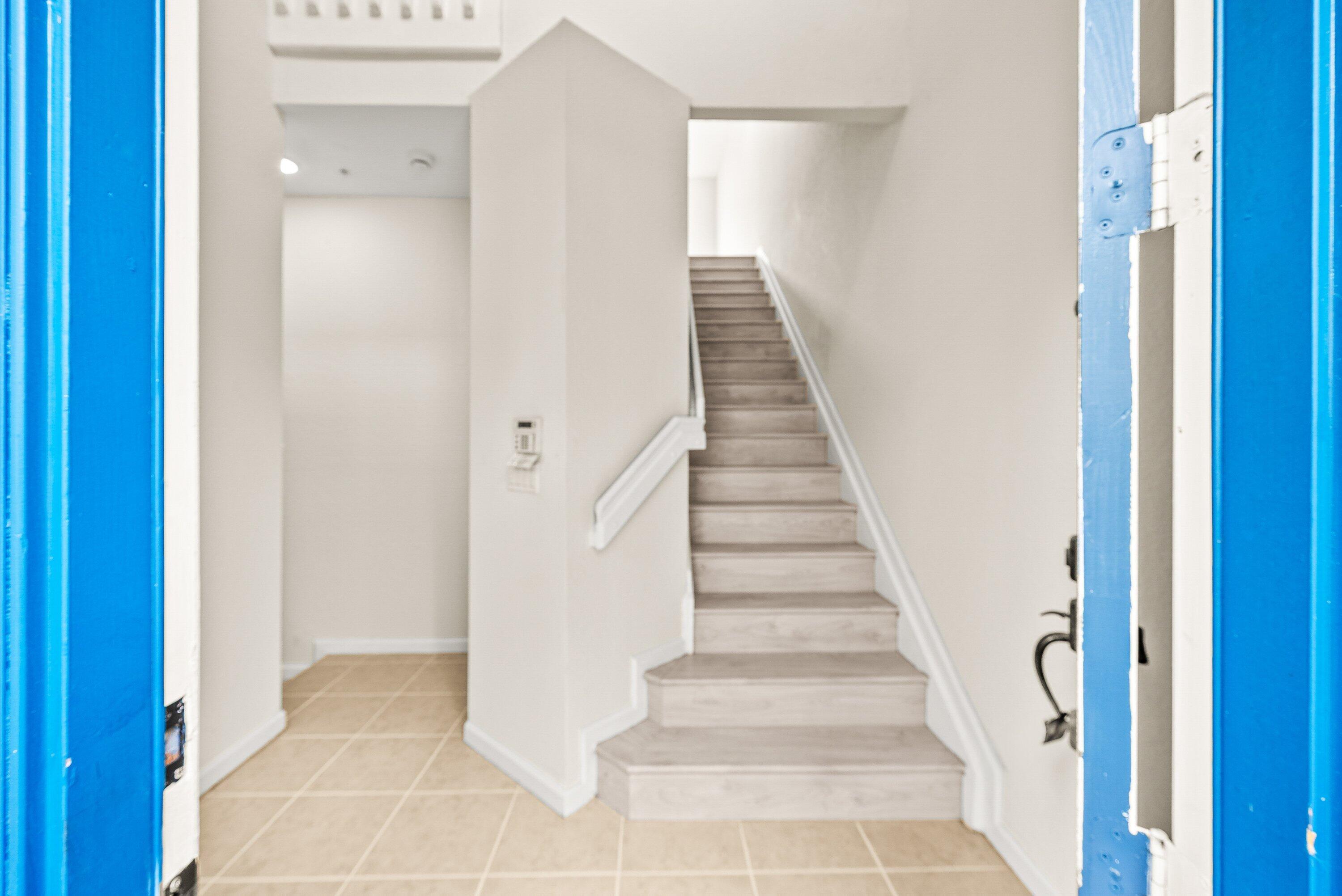 3187 North Oasis Drive Boynton Beach, FL 33426 - Photo 3 of 41 a view of an entryway with staircase