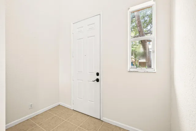 a view of an empty room with closet
