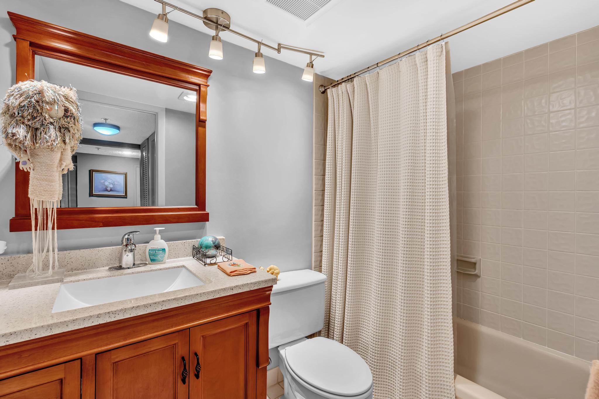 6320 Boca Del Mar Drive, Unit 303 Boca Raton, FL 33433 - Photo 12 of 42 a bathroom with a sink a toilet and shower