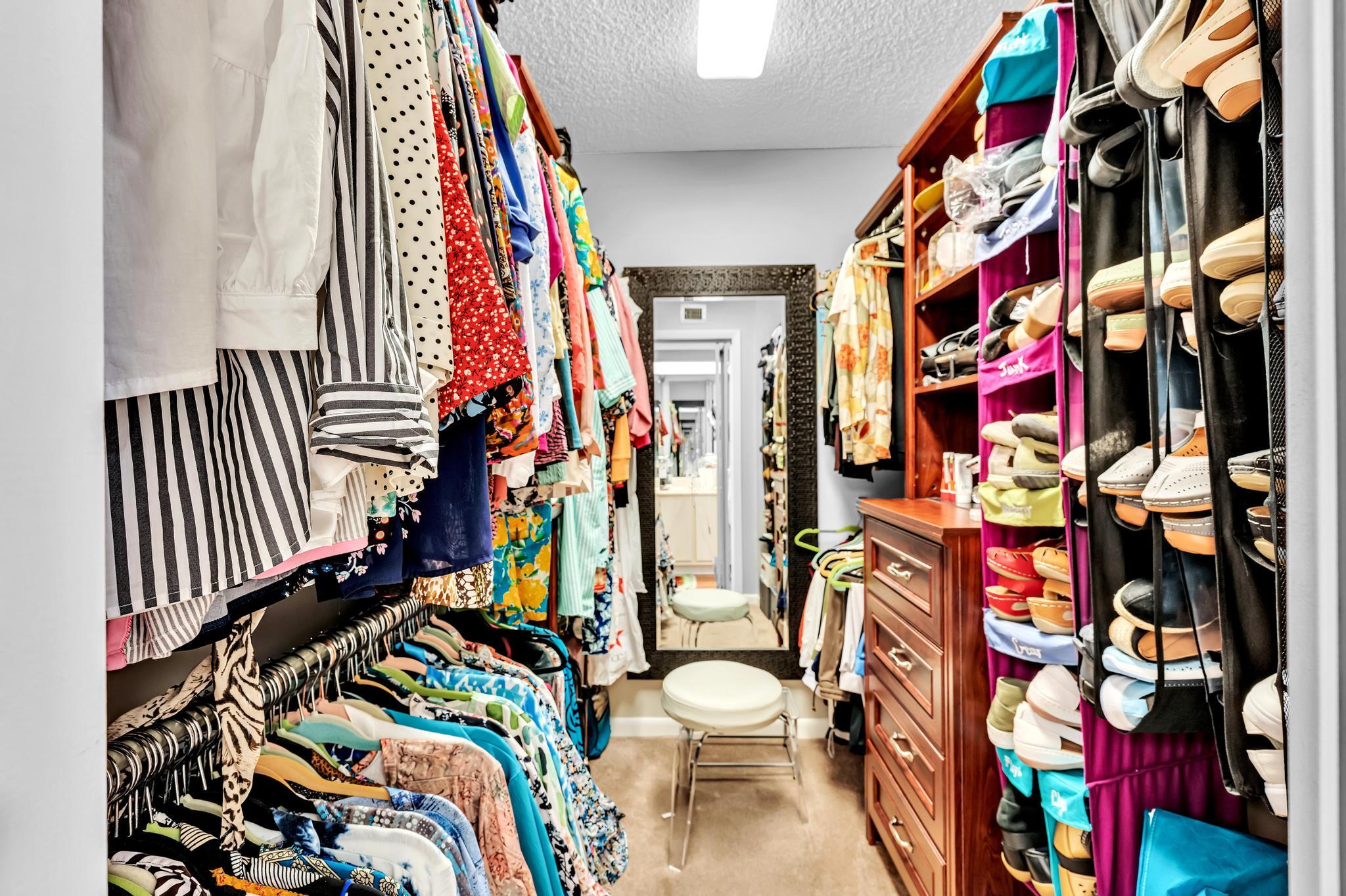 6320 Boca Del Mar Drive, Unit 303 Boca Raton, FL 33433 - Photo 25 of 42 a view of walk in closet with clothes and shoes