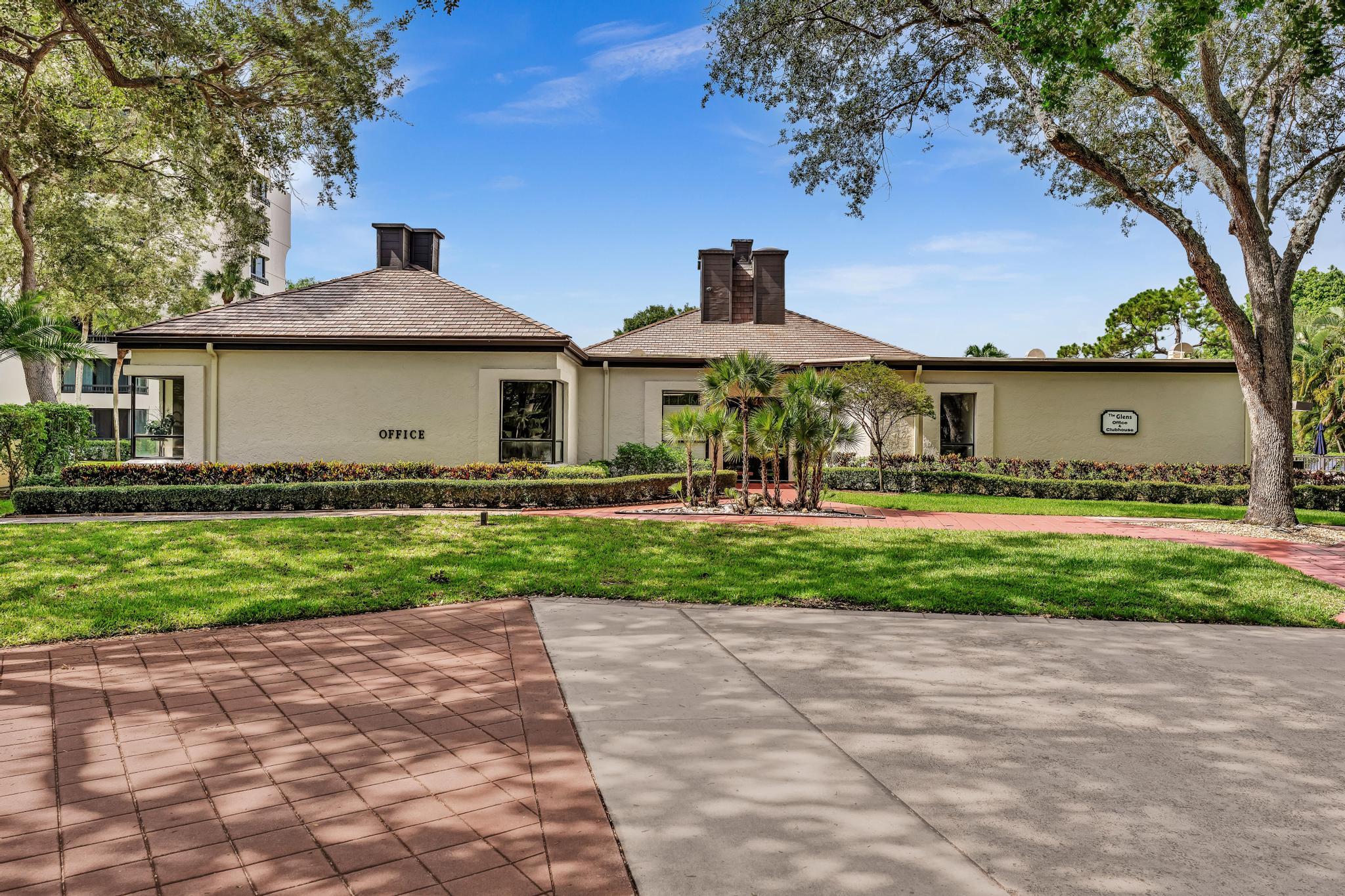 6320 Boca Del Mar Drive, Unit 303 Boca Raton, FL 33433 - Photo 38 of 42 a front view of a house with a garden