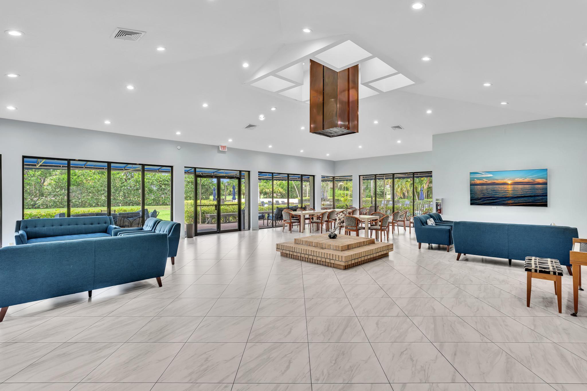 6320 Boca Del Mar Drive, Unit 303 Boca Raton, FL 33433 - Photo 39 of 42 a living room with furniture and a large window