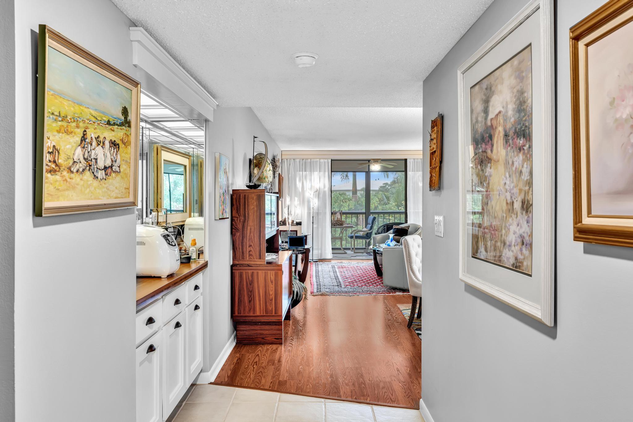 6320 Boca Del Mar Drive, Unit 303 Boca Raton, FL 33433 - Photo 10 of 42 a very nice looking living room with furniture and a large window