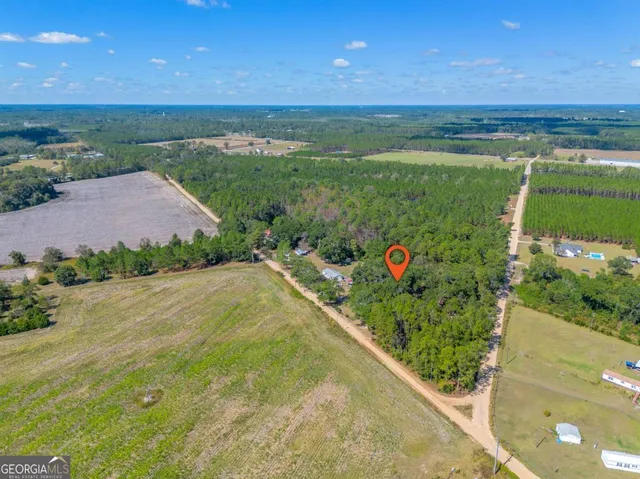 an aerial view of a golf course with outdoor space
