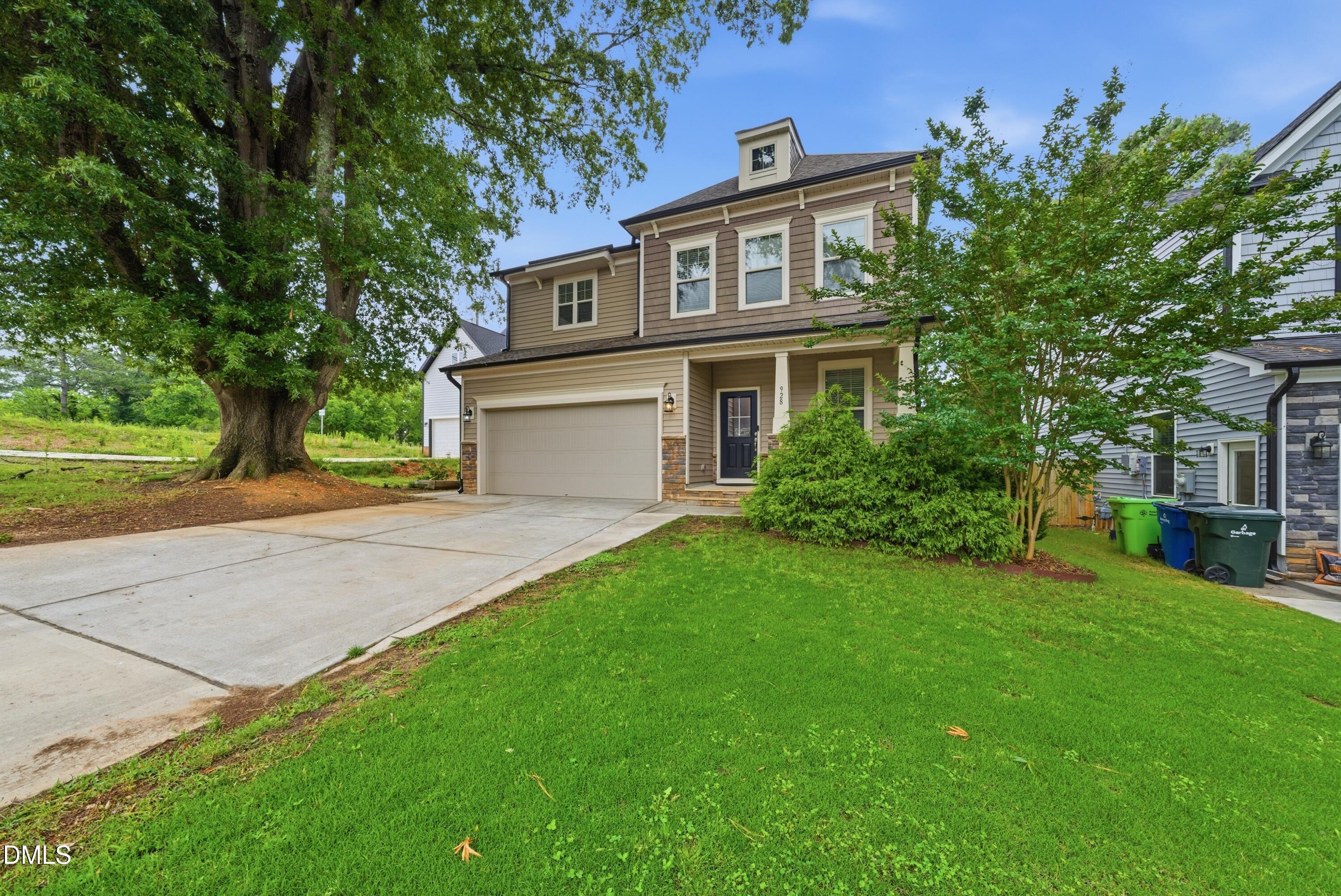 928 Barringer Drive Raleigh, NC 27606 - Photo 2 of 40 a view of a house with a yard