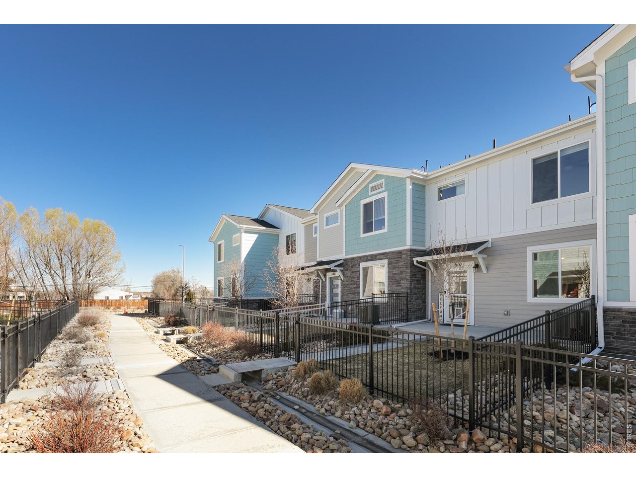 610 Stonebridge Drive Longmont, CO 80503 - Photo 1 of 30 a view of a house with backyard