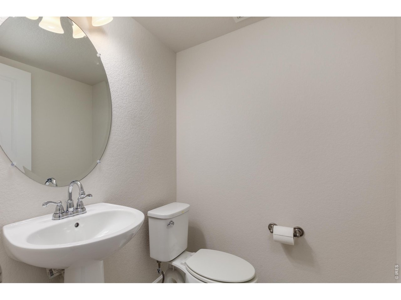 610 Stonebridge Drive Longmont, CO 80503 - Photo 12 of 30 a bathroom with a sink mirror and toilet