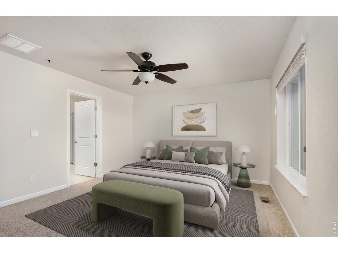 610 Stonebridge Drive Longmont, CO 80503 - Photo 13 of 30 a bedroom with a large bed and a chandelier