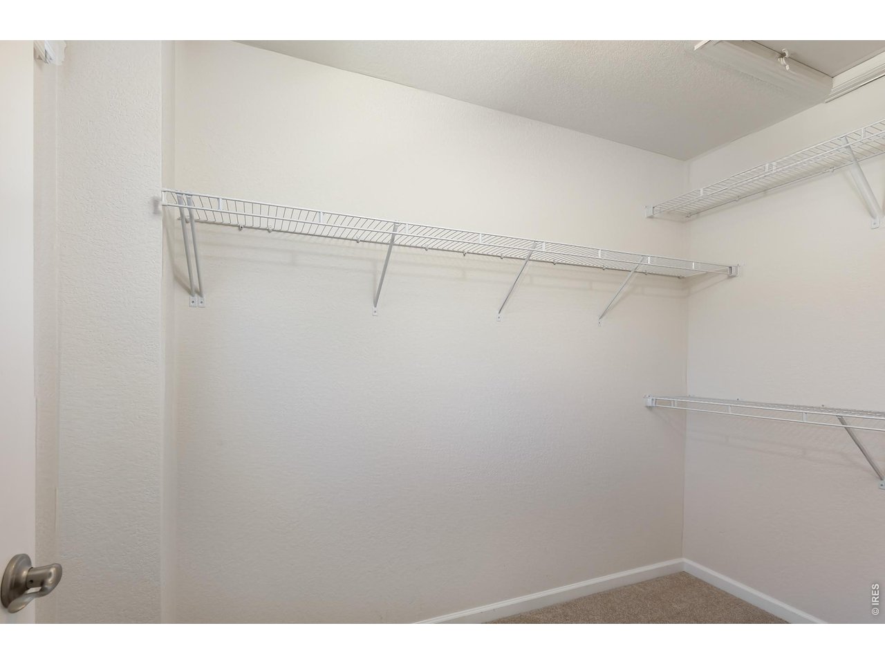 610 Stonebridge Drive Longmont, CO 80503 - Photo 16 of 30 a view of a room with racks on the wall