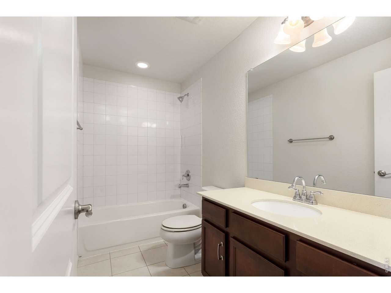 610 Stonebridge Drive Longmont, CO 80503 - Photo 20 of 30 a bathroom with a sink a toilet and shower