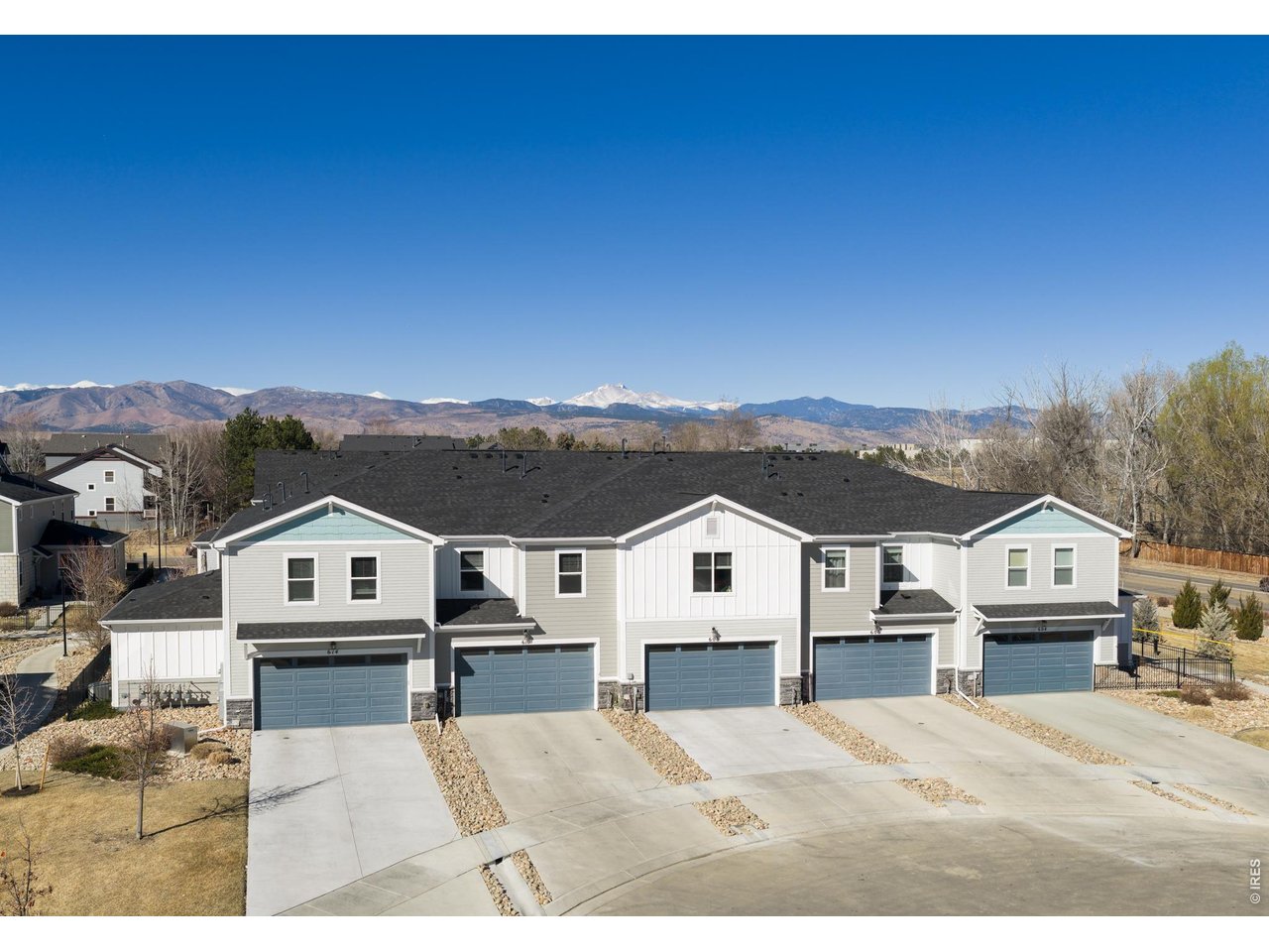 610 Stonebridge Drive Longmont, CO 80503 - Photo 24 of 30 a view of house that has a big yard