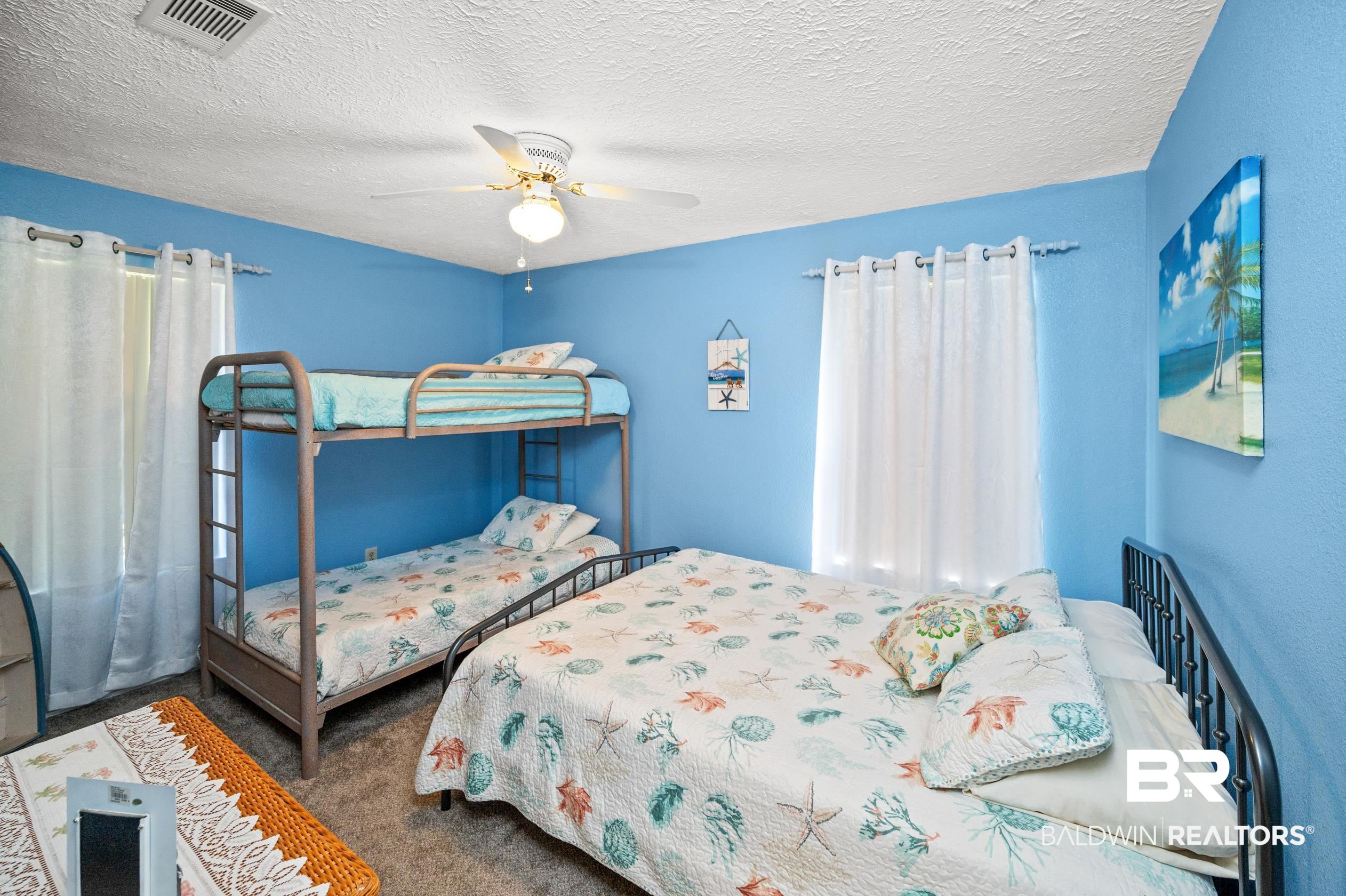 2772 Santa Rosa Circle Lillian, AL 36549 - Photo 21 of 50 Carpeted bedroom featuring a textured ceiling and ceiling fan