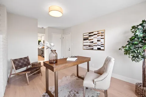 a spacious bedroom with a bed and a couch