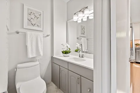 a view of a bedroom with washer and dryer