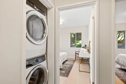 a backyard of a house with table and chairs