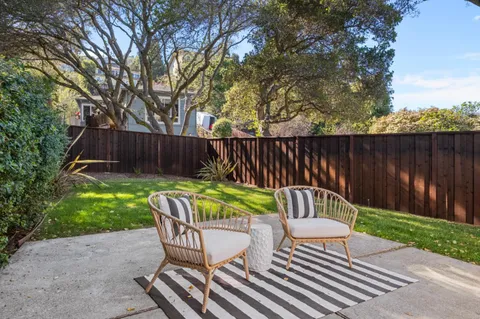 a patio with table and chairs