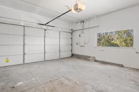 an aerial view of residential houses with city view