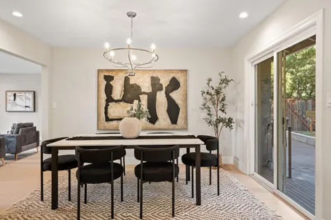 a view of a dining room with furniture window and outside view