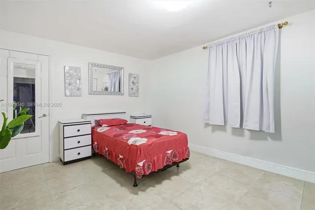 a bedroom with a bed and a cabinets