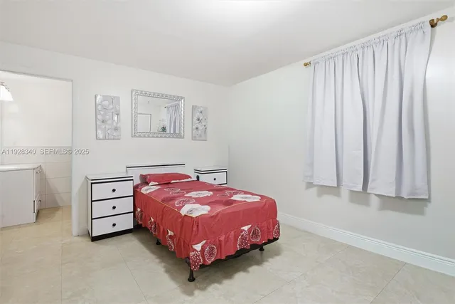 a bedroom with a bed and a cabinets