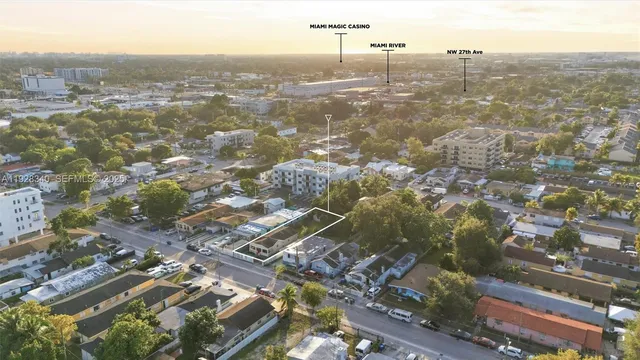 an aerial view of residential houses with city view and lake view