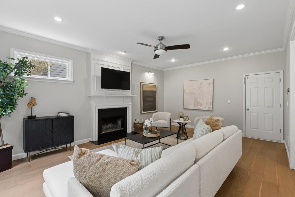 2120 Traywick Chase Alpharetta, GA 30004 - Photo 18 of 54 a living room with furniture a fireplace and a flat screen tv