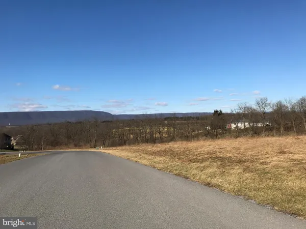 a view of an ocean and mountain