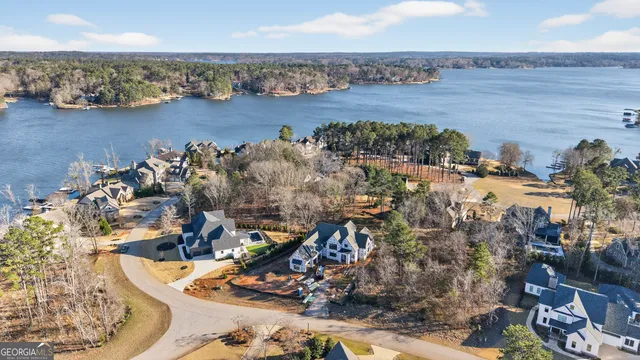 an aerial view of a houses with ocean view