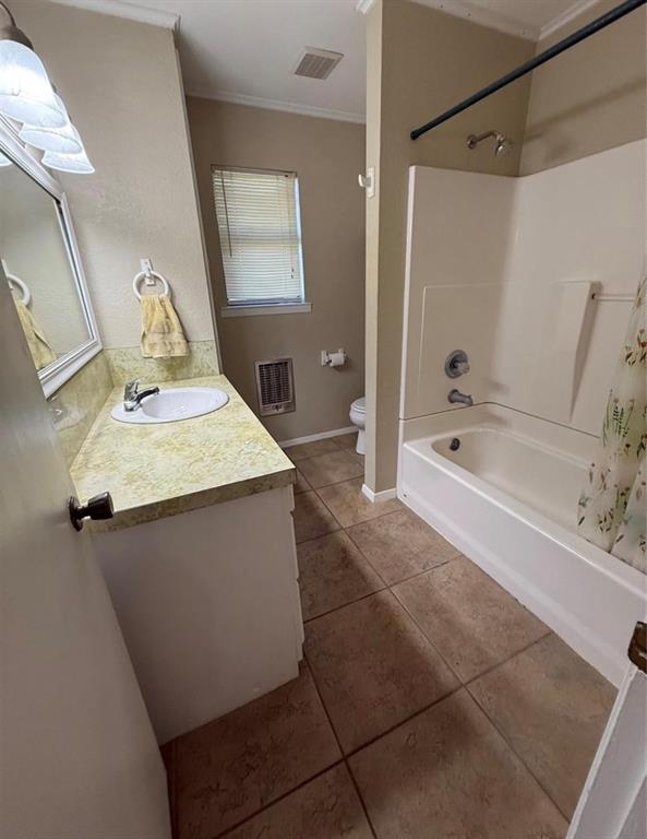 105 West Elm Gustine, TX 76455 - Photo 12 of 21 a bathroom with a bathtub sink and mirror