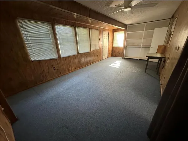 a view of empty room with windows