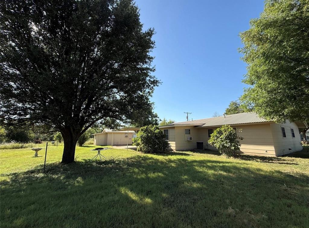105 West Elm Gustine, TX 76455 - Photo 2 of 21 a view of a house with backyard and sitting area
