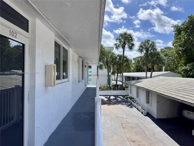 a patio with table and chairs