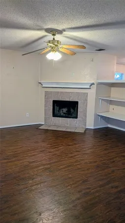 a view of an empty room with a fireplace