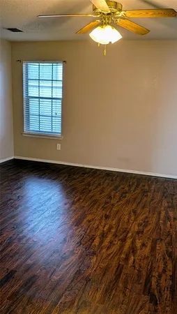 a bathroom with a toilet a sink and a mirror