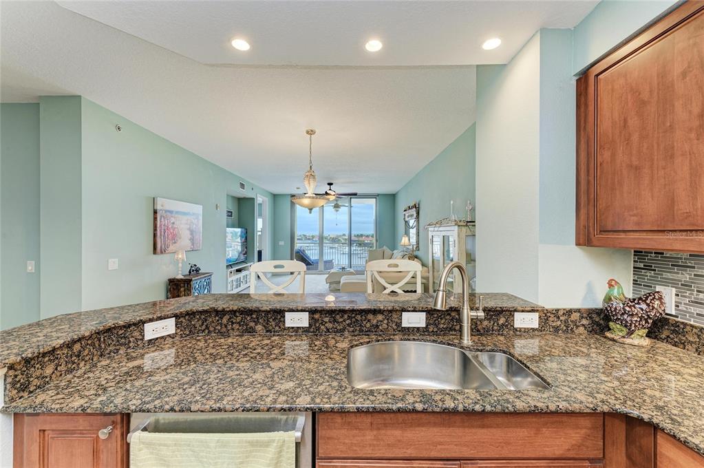 610 Riviera Dunes Way, Unit 406 Palmetto, FL 34221 - Photo 23 of 49 a kitchen with counter top space a sink and cabinets