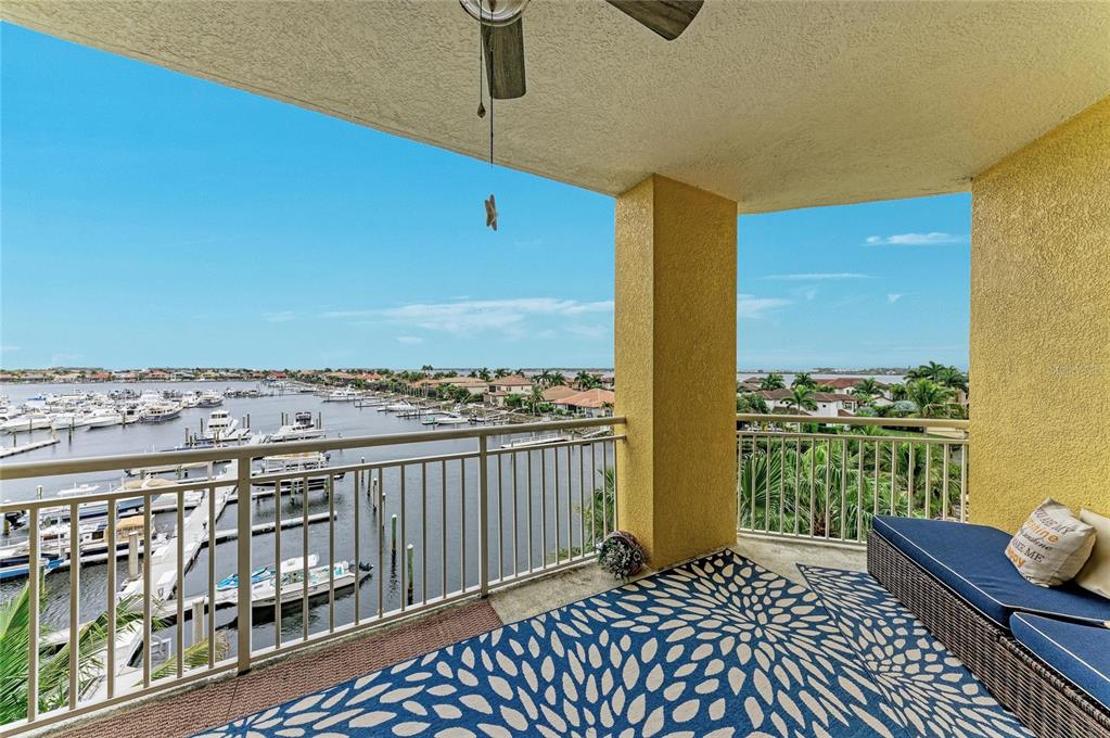 610 Riviera Dunes Way, Unit 406 Palmetto, FL 34221 - Photo 34 of 49 a view of a balcony with wooden floor