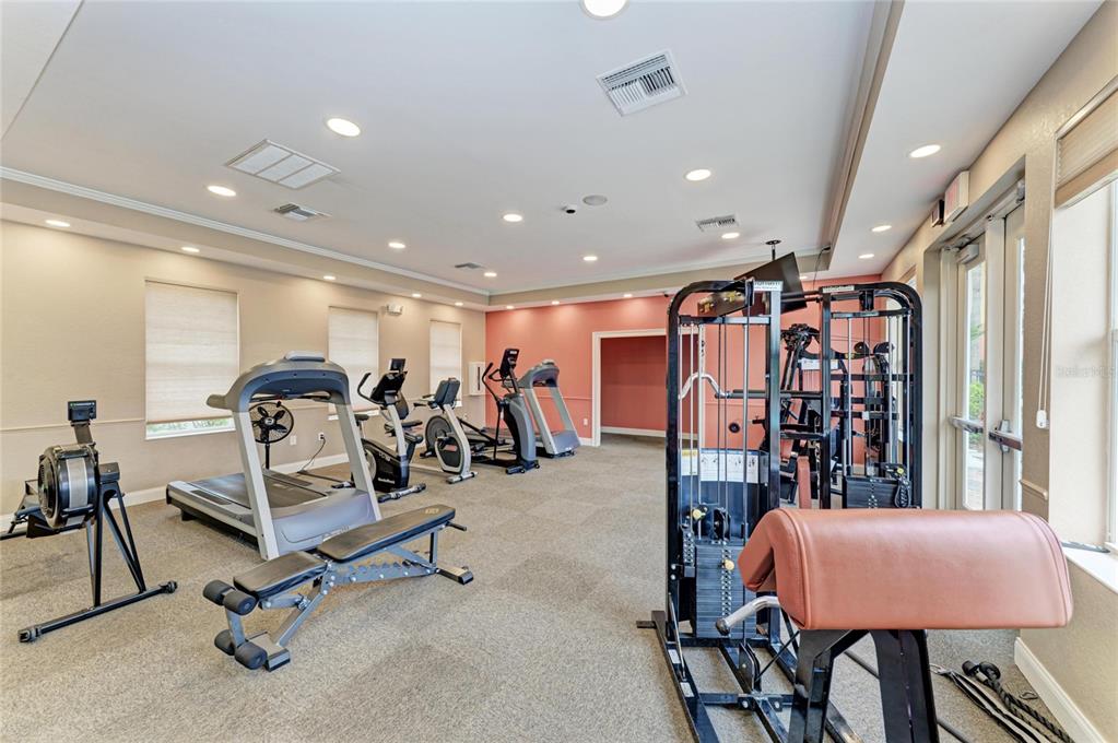 610 Riviera Dunes Way, Unit 406 Palmetto, FL 34221 - Photo 46 of 49 a view of a room with gym equipment