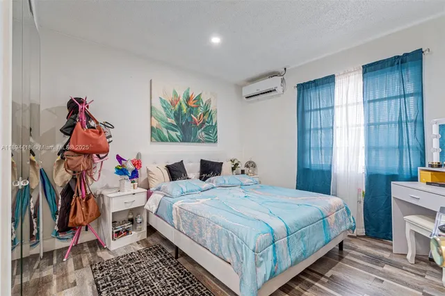 a bedroom with a bed and dresser